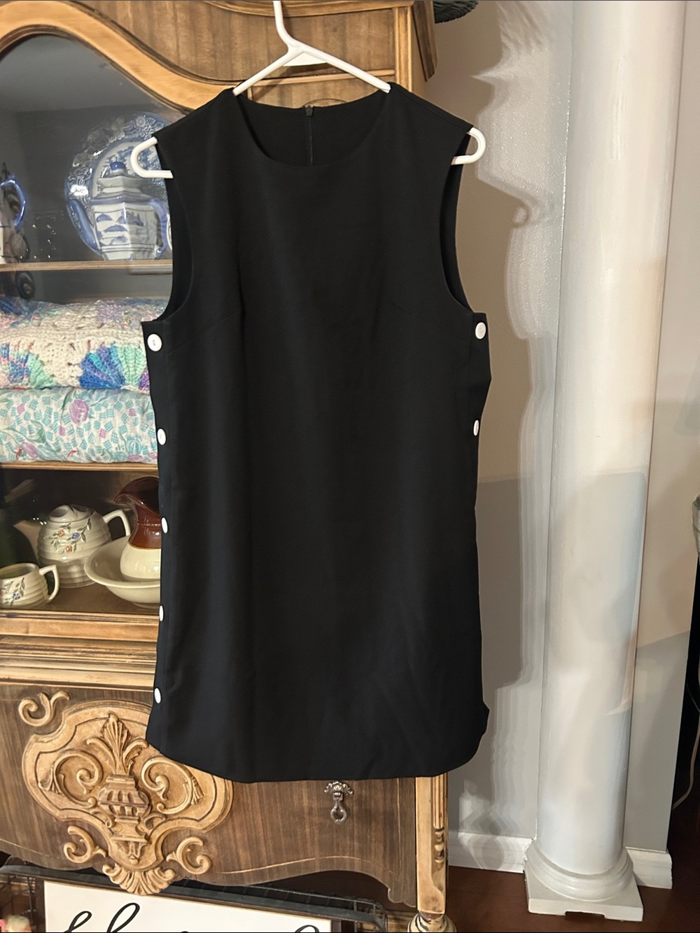Classic Black Sleeveless Shift Dress with Side Button Detail
